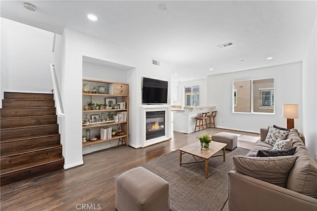 456 W Linden Dr, Orange, CA 92865 - living area with dark wood finished floors, stairs, a glass covered fireplace, and recessed lighting