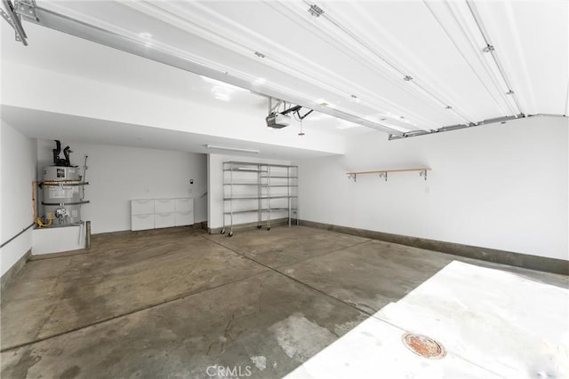 456 W Linden Dr, Orange, CA 92865 - garage with strapped water heater and a garage door opener
