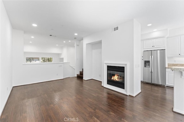456 W Linden Dr, Orange, CA 92865 - unfurnished living room featuring dark wood-style flooring, a multi sided fireplace, recessed lighting, and stairs