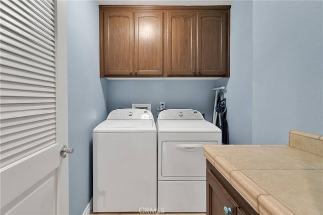 9525 Cambria Ct, Phelan, CA 92371 - washroom featuring washing machine and clothes dryer and cabinet space