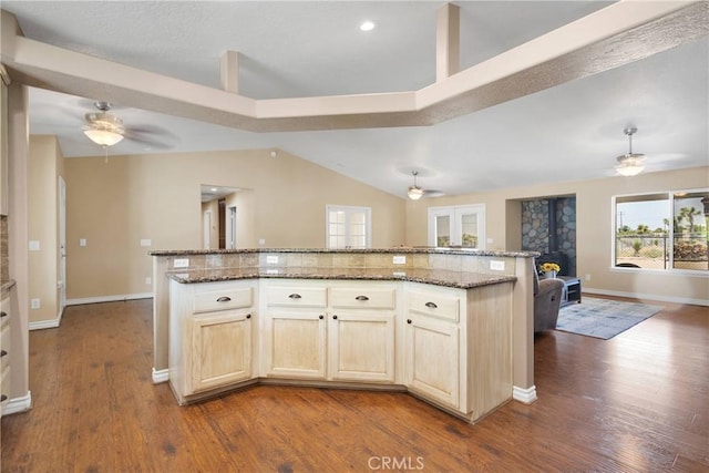 9525 Cambria Ct, Phelan, CA 92371 - kitchen featuring ceiling fan, open floor plan, dark wood-type flooring, stone countertops, and vaulted ceiling