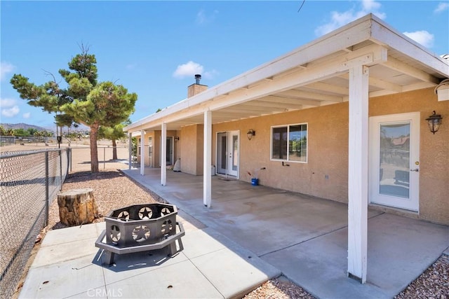 9525 Cambria Ct, Phelan, CA 92371 - fenced backyard featuring a patio area and a fire pit