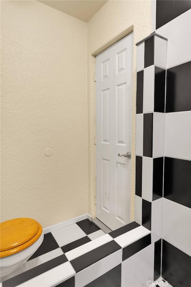 9525 Cambria Ct, Phelan, CA 92371 - bathroom with tile patterned floors and a textured wall