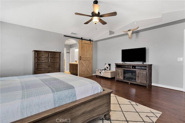 9525 Cambria Ct, Phelan, CA 92371 - bedroom with lofted ceiling, wood finished floors, arched walkways, a barn door, and ceiling fan