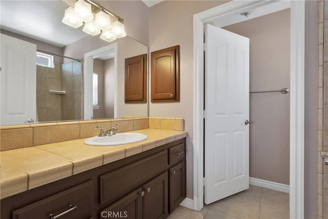 9525 Cambria Ct, Phelan, CA 92371 - full bath with vanity, tile patterned floors, and a tile shower