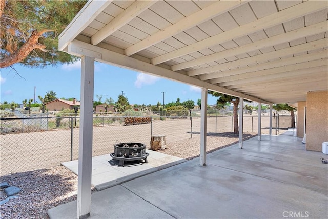 9525 Cambria Ct, Phelan, CA 92371 - fenced backyard featuring an outdoor fire pit and a patio