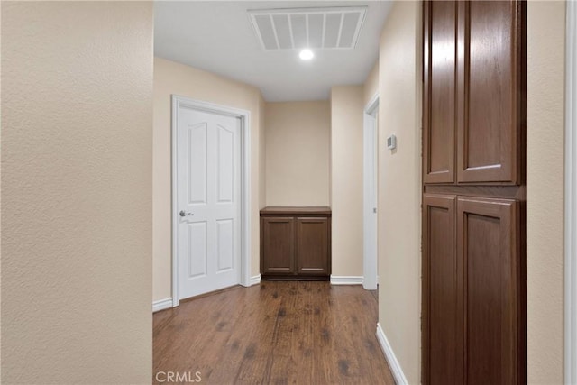 9525 Cambria Ct, Phelan, CA 92371 - hall featuring dark wood finished floors and baseboards