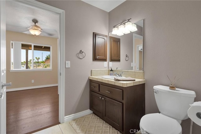 9525 Cambria Ct, Phelan, CA 92371 - bathroom with vanity, a ceiling fan, and tile patterned flooring