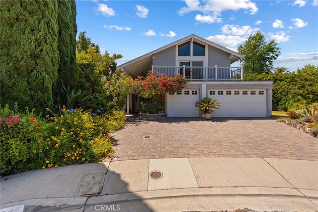5230 Harbour Heights Ct, San Diego, CA 92109 - view of front facade with decorative driveway, a garage, and stucco siding