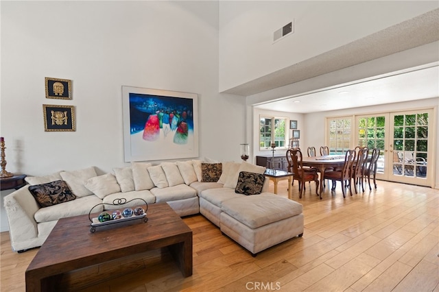 5230 Harbour Heights Ct, San Diego, CA 92109 - living area with light wood-type flooring and a towering ceiling