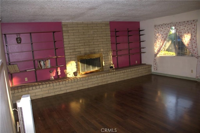 12570 Jacaranda Pl, Chino, CA 91710 - unfurnished living room with a textured ceiling, wood-type flooring, and a fireplace