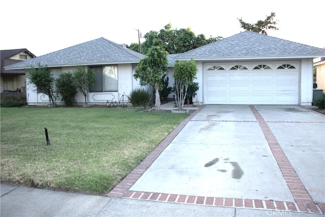 12570 Jacaranda Pl, Chino, CA 91710 - ranch-style home featuring a garage, a shingled roof, concrete driveway, and a front lawn
