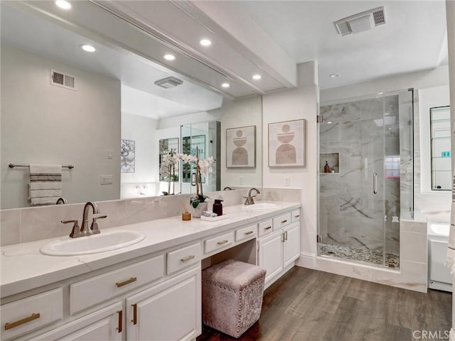 23034 Park Este, Calabasas, CA 91302 - full bathroom with double vanity, recessed lighting, wood finished floors, a marble finish shower, and a tub to relax in