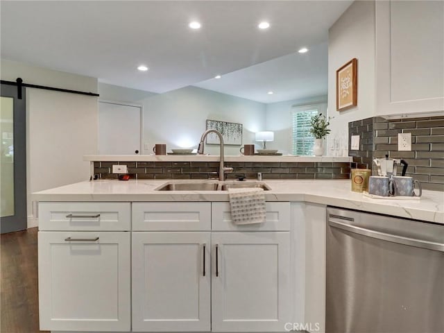 23034 Park Este, Calabasas, CA 91302 - kitchen featuring stainless steel dishwasher, white cabinetry, tasteful backsplash, recessed lighting, and light stone countertops