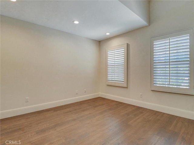23034 Park Este, Calabasas, CA 91302 - empty room with wood finished floors, plenty of natural light, and recessed lighting