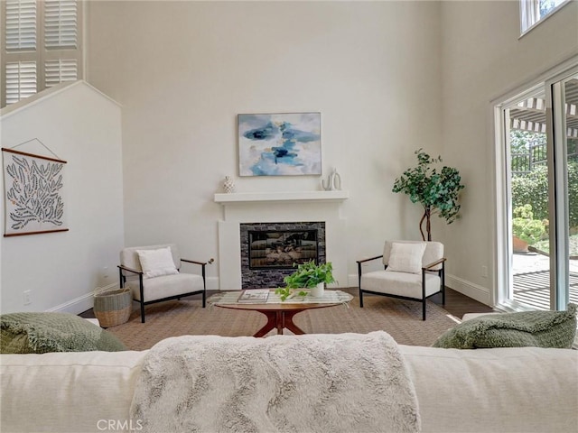 23034 Park Este, Calabasas, CA 91302 - living room with a high ceiling, a glass covered fireplace, and wood finished floors