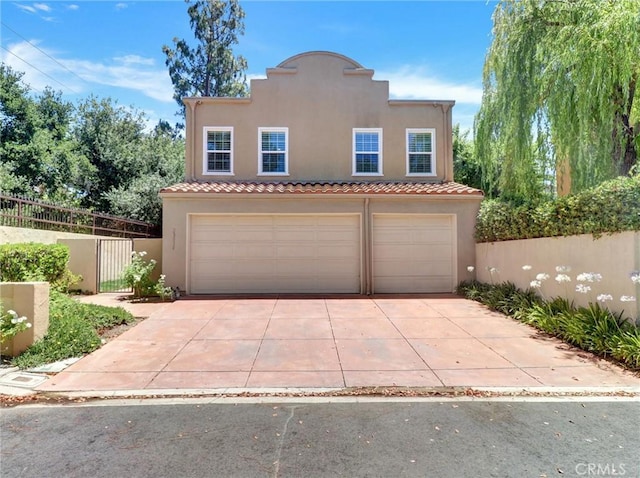 23034 Park Este, Calabasas, CA 91302 - mediterranean / spanish home with stucco siding, a garage, driveway, and a tile roof