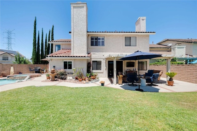 6140 Meadow Lark Dr, La Verne, CA 91750 - back of property with a chimney, a patio area, a fenced backyard, and a pool with connected hot tub