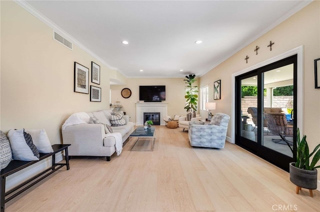 6140 Meadow Lark Dr, La Verne, CA 91750 - living area with light wood-style flooring, recessed lighting, crown molding, and a glass covered fireplace