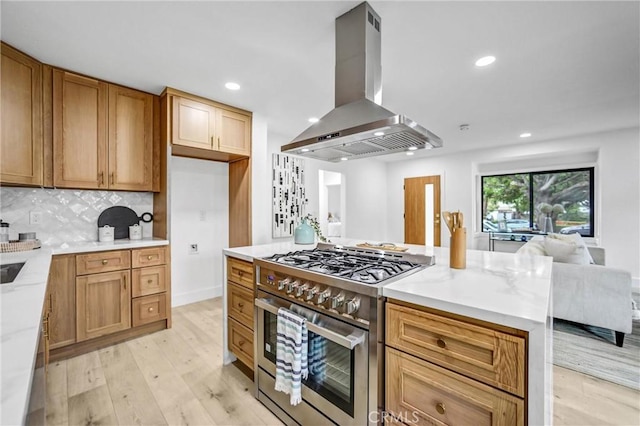 57 S Grand Oaks Ave, Pasadena, CA 91107 - kitchen with island range hood, double oven range, open floor plan, light wood-type flooring, and recessed lighting