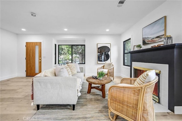 57 S Grand Oaks Ave, Pasadena, CA 91107 - living room with a lit fireplace, healthy amount of natural light, recessed lighting, and wood finished floors