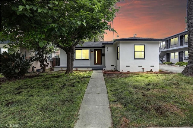 57 S Grand Oaks Ave, Pasadena, CA 91107 - view of front of property with stucco siding, a front yard, and crawl space