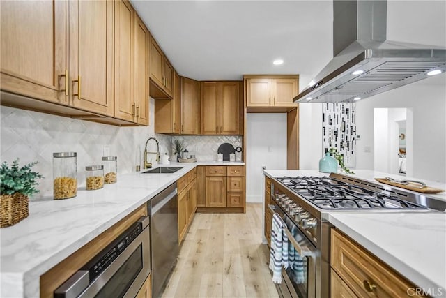 57 S Grand Oaks Ave, Pasadena, CA 91107 - kitchen featuring wall chimney exhaust hood, appliances with stainless steel finishes, light wood-style flooring, light stone counters, and tasteful backsplash