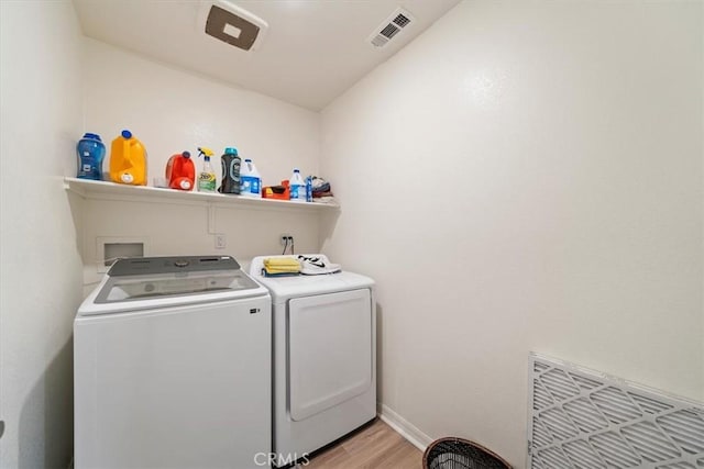 16814 Desert Star St, Victorville, CA 92394 - washroom with washing machine and clothes dryer and light wood-style floors