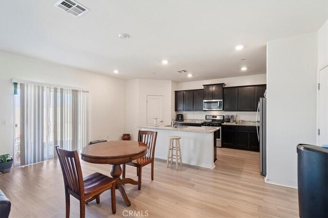 16814 Desert Star St, Victorville, CA 92394 - dining room featuring light wood-style floors and recessed lighting
