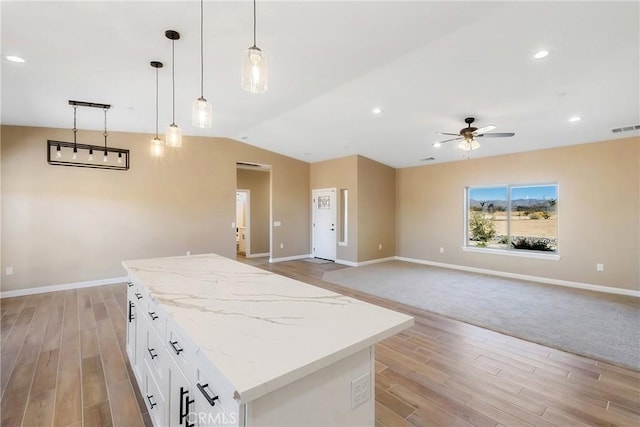 11228 Mockingbird, Apple Valley, CA 92308 - kitchen with a kitchen island, open floor plan, a ceiling fan, light wood finished floors, and lofted ceiling