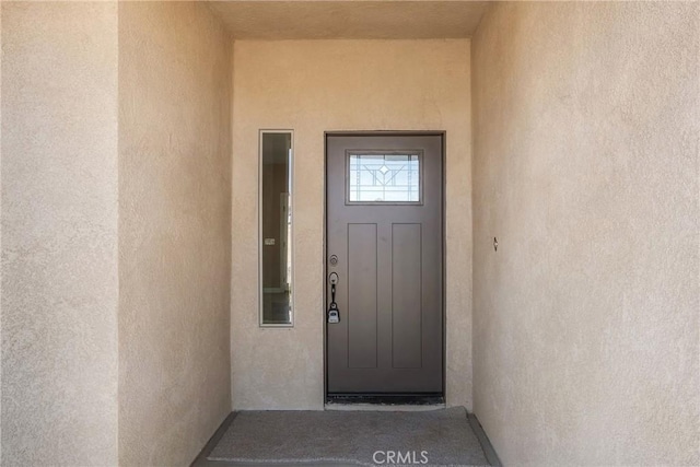 11228 Mockingbird, Apple Valley, CA 92308 - doorway to property with stucco siding