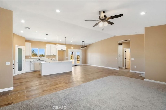 11228 Mockingbird, Apple Valley, CA 92308 - kitchen with light wood finished floors, a kitchen island, a ceiling fan, white cabinets, and recessed lighting