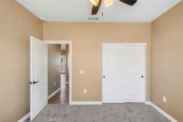 11228 Mockingbird, Apple Valley, CA 92308 - unfurnished bedroom with carpet, a closet, and a ceiling fan