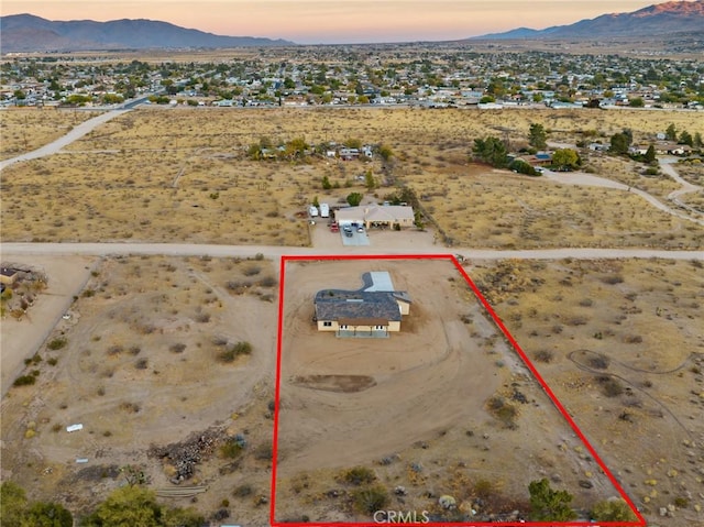 11228 Mockingbird, Apple Valley, CA 92308 - aerial view at dusk of view of desert landscape, property boundaries highlighted, a mountain view, and a view of rural / pastoral area
