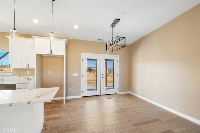 11228 Mockingbird, Apple Valley, CA 92308 - unfurnished dining area with light wood-type flooring, french doors, and recessed lighting