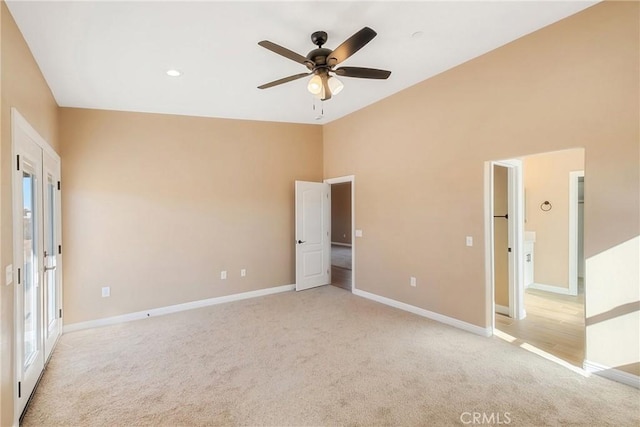 11228 Mockingbird, Apple Valley, CA 92308 - unfurnished bedroom with light colored carpet, high vaulted ceiling, and ceiling fan