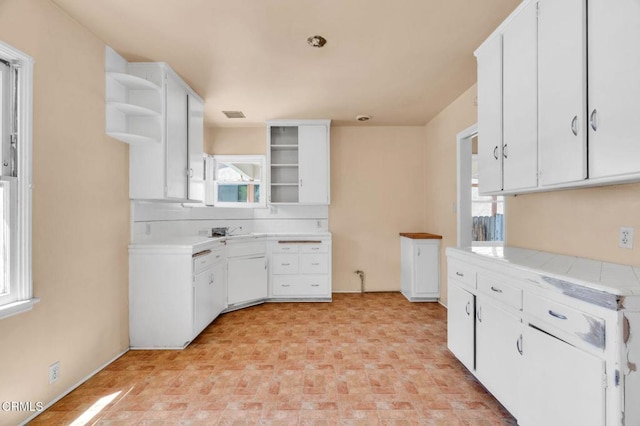 4127 Scandia Way, Los Angeles, CA 90065 - kitchen featuring open shelves, white cabinets, and tasteful backsplash