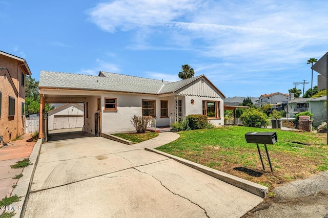 4127 Scandia Way, Los Angeles, CA 90065 - ranch-style house with concrete driveway, an outdoor structure, an attached carport, and stucco siding