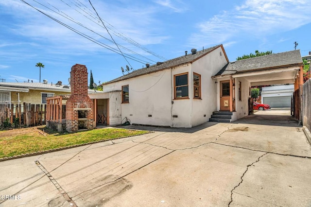 4127 Scandia Way, Los Angeles, CA 90065 - view of front facade with stucco siding, driveway, an attached carport, and crawl space