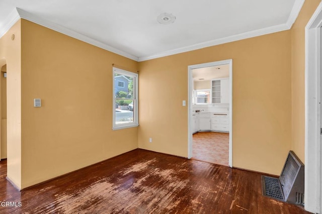4127 Scandia Way, Los Angeles, CA 90065 - unfurnished room featuring dark wood finished floors, crown molding, and arched walkways