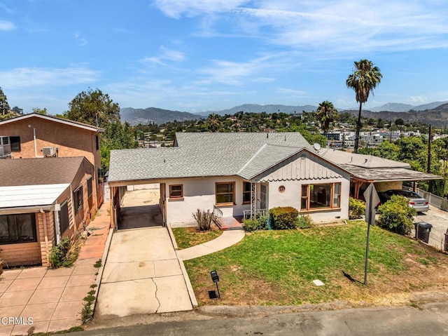 4127 Scandia Way, Los Angeles, CA 90065 - view of front of house with concrete driveway, a mountain view, an attached carport, and a front yard