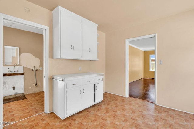 4127 Scandia Way, Los Angeles, CA 90065 - kitchen featuring light countertops, open shelves, white cabinets, and brick patterned floors