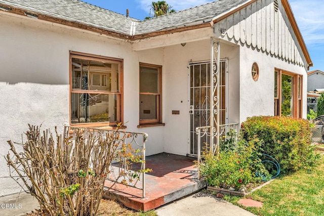 4127 Scandia Way, Los Angeles, CA 90065 - property entrance featuring a shingled roof, board and batten siding, and stucco siding