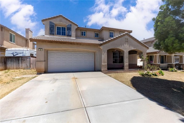26 Billings Ave, Beaumont, CA 92223 - mediterranean / spanish-style home featuring driveway, stucco siding, and a tiled roof