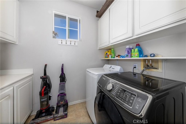 26 Billings Ave, Beaumont, CA 92223 - laundry room featuring washer and dryer, cabinet space, and light tile patterned floors