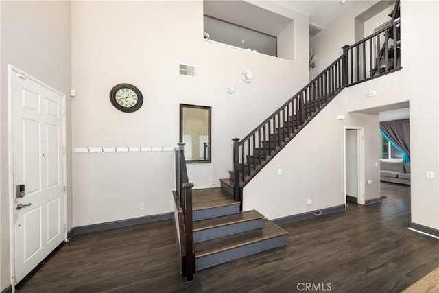 26 Billings Ave, Beaumont, CA 92223 - staircase featuring wood finished floors and a towering ceiling