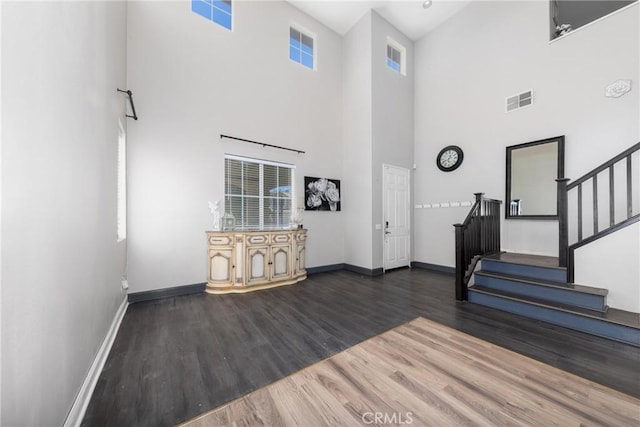 26 Billings Ave, Beaumont, CA 92223 - foyer with a towering ceiling, wood finished floors, and stairs