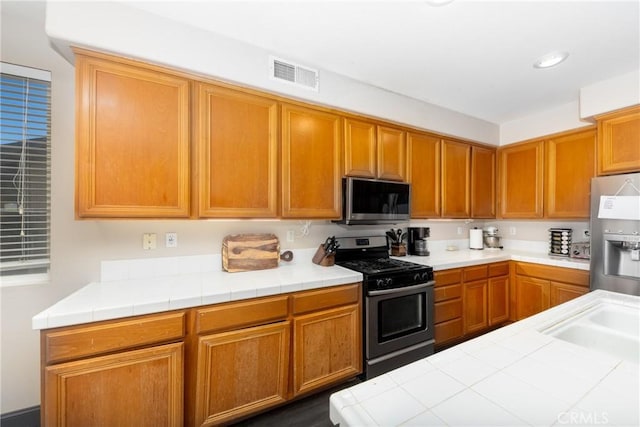 26 Billings Ave, Beaumont, CA 92223 - kitchen featuring appliances with stainless steel finishes, tile counters, and recessed lighting