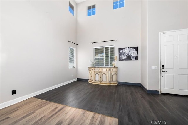 26 Billings Ave, Beaumont, CA 92223 - unfurnished living room with a high ceiling and dark wood finished floors