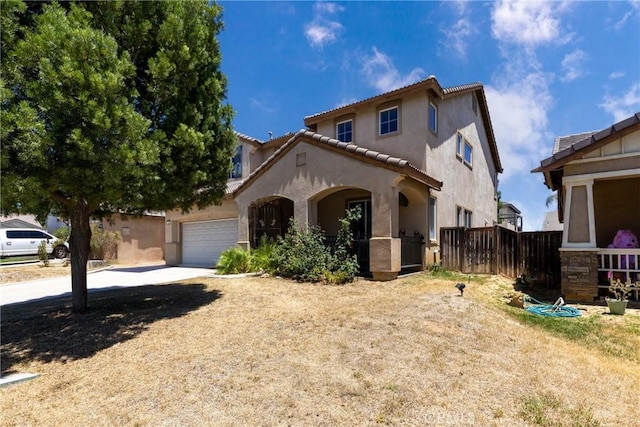 26 Billings Ave, Beaumont, CA 92223 - view of front of house with stucco siding, driveway, a garage, and a tile roof